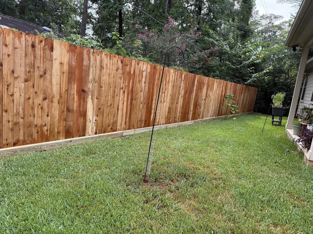 Completed cedar privacy fence in the Conroe area
